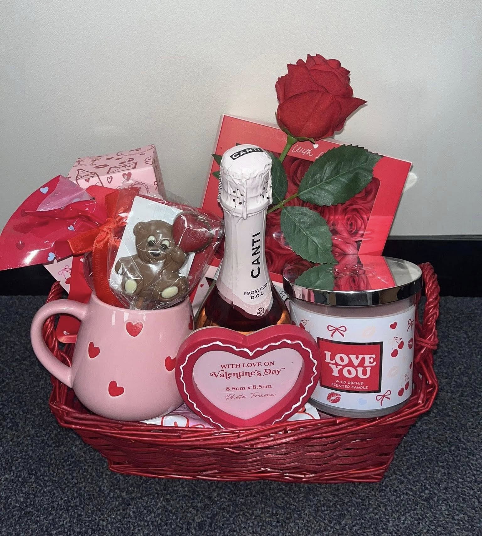 Red and pink Valentine's Hamper with candle, roses, prosecco, photo frame, mug and chocolate